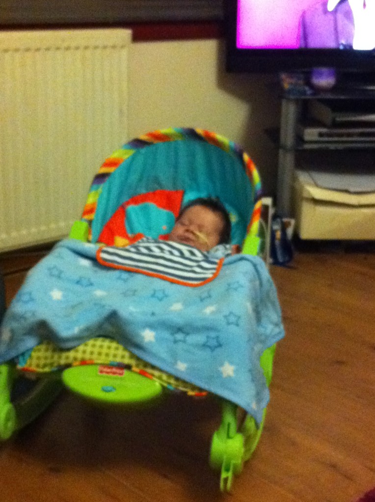Braveheart Zachary sleeping soundly in his musical vibrating chair